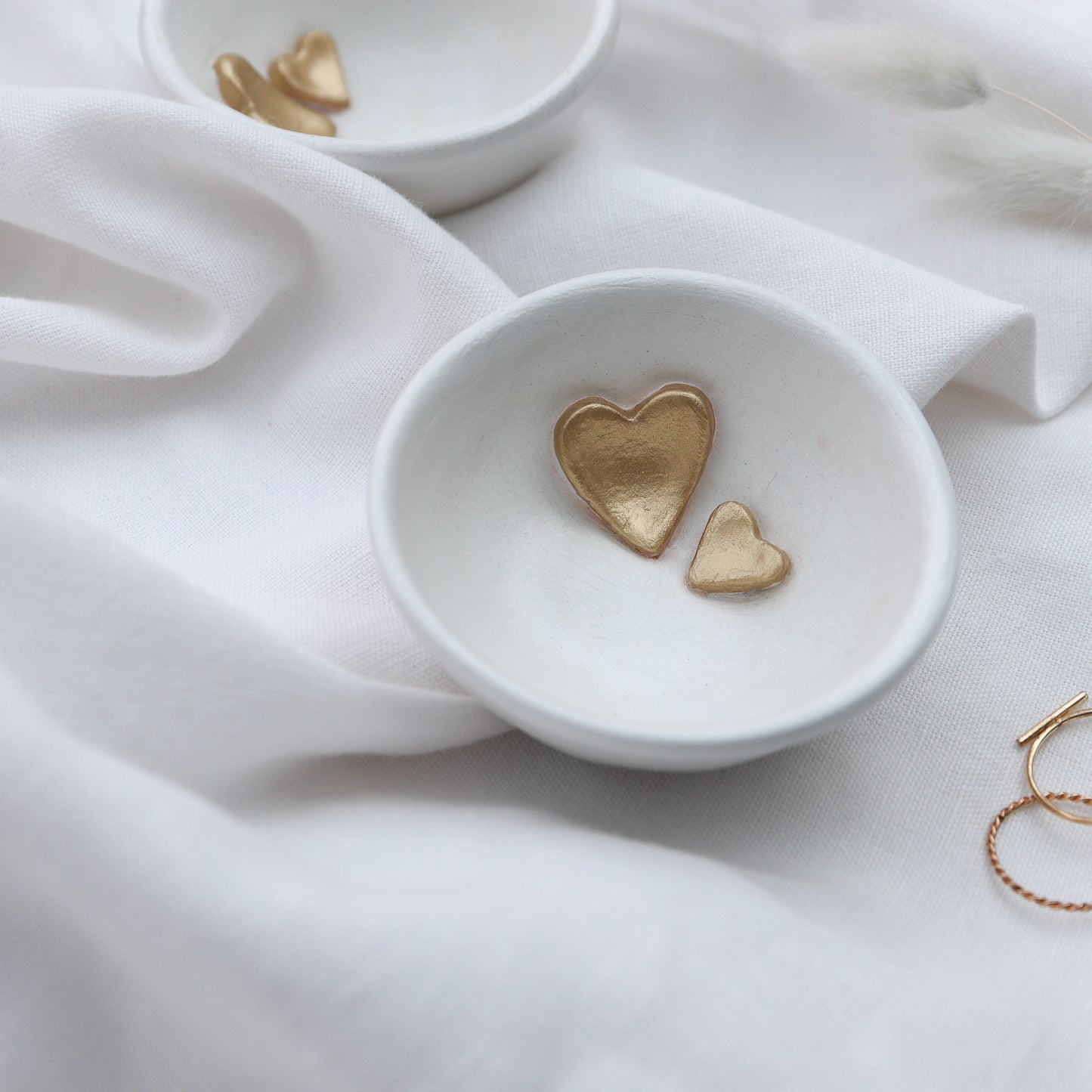 Small white trinket dish with gold hearts